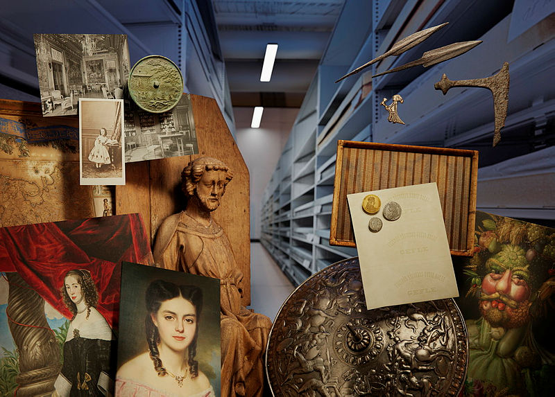 Image with a lot of museum objects set in the environment of a museum storage.