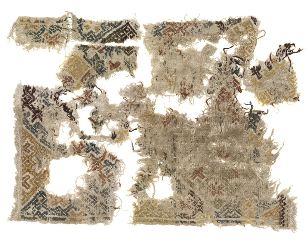 Fragment ihoplagda till en dyna.